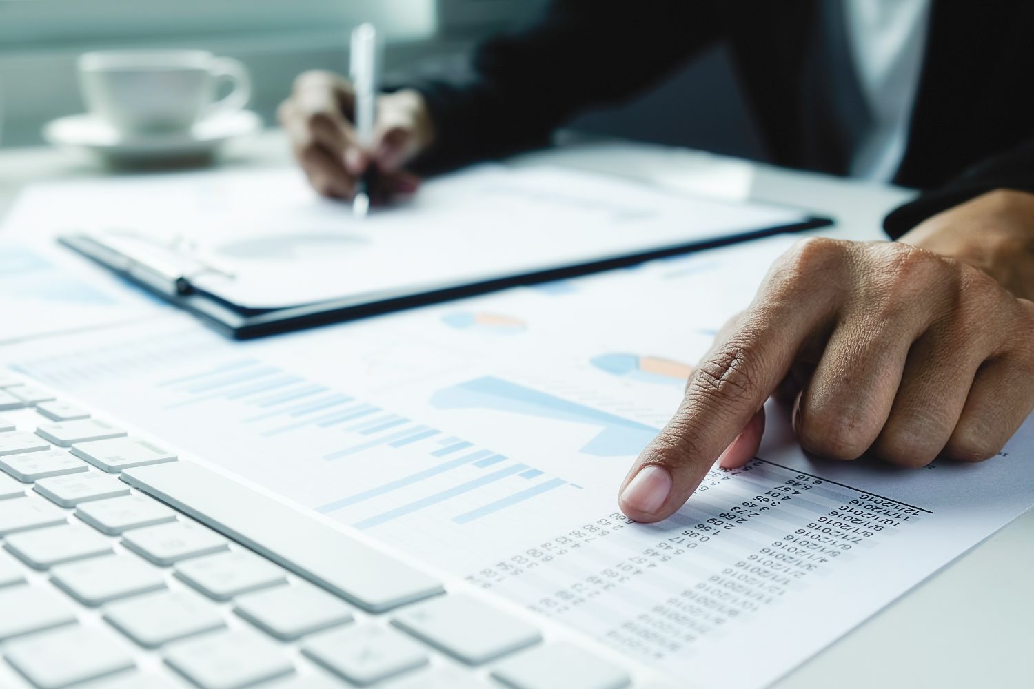 A person pointing at data figures